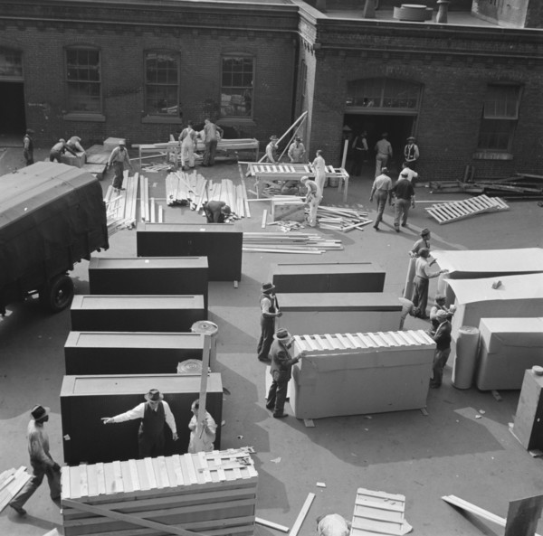 United States government workers and carpenters making crates for steel... Washington, D.C., 1942. Creator: Gordon Parks.