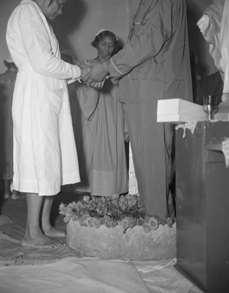 Reverend Vondell Gassaway, pastor of the St. Martin's Spiritual Church..., Washington, D.C., 1942. Creator: Gordon Parks.