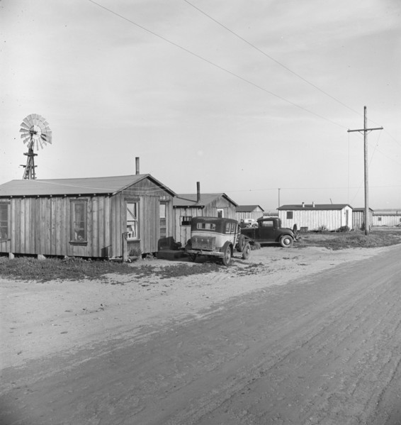 Rented cabins, ten dollars a month...Arkansawyers auto camp, Greenfield, Salinas Valley, CA, 1939. Creator: Dorothea Lange.