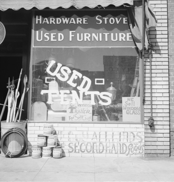 Storefront of San Joaquin Valley town, Fresno, on U.S. 99, California, 1939. Creator: Dorothea Lange.