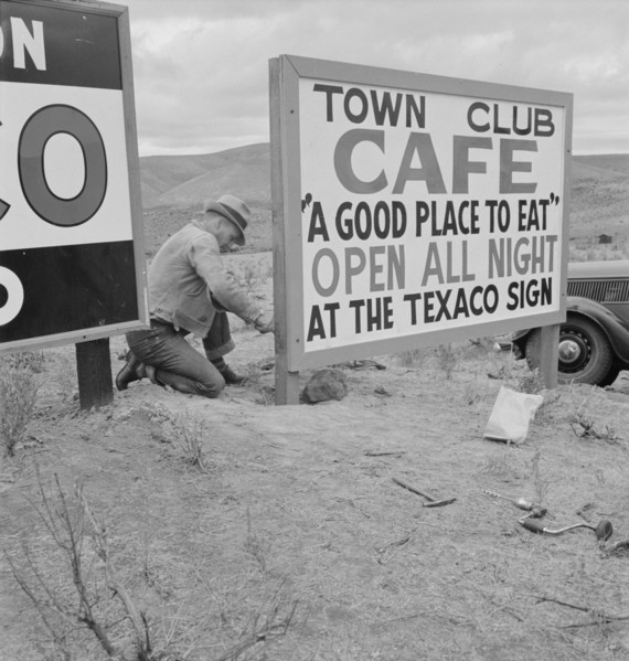 New sign along highway advertises a new enterprise in the lonely town of Maupin, Oregon, 1939. Creator: Dorothea Lange.