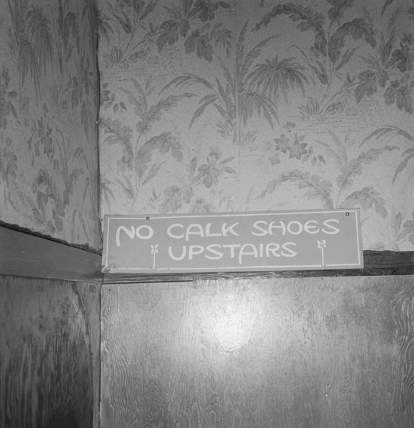 Sign on staircase on Brooks Hotel in a town..., West Carlton, Yamhill County, Oregon, 1939. Creator: Dorothea Lange.