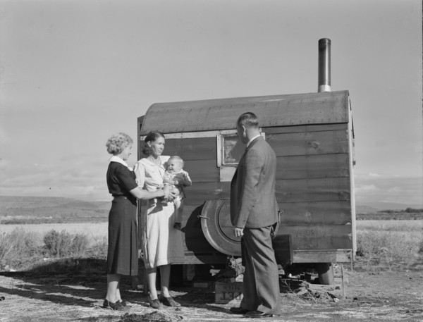 The doctor reassures the mother...the sick baby, Merrill, Klamath County, Oregon, 1939. Creator: Dorothea Lange.