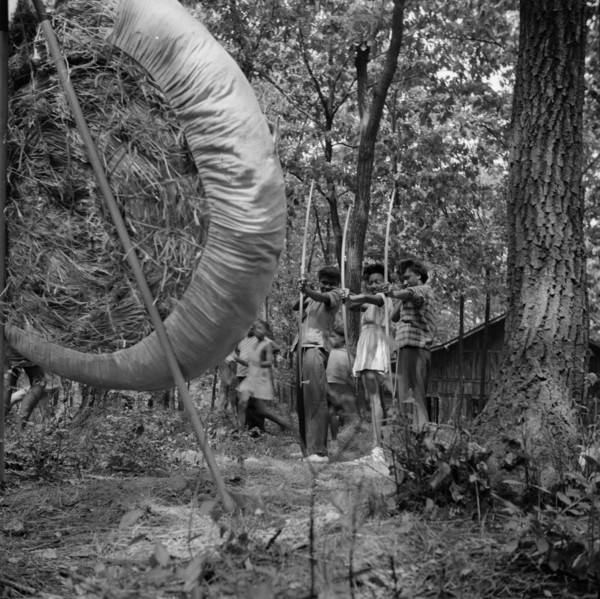 Practicing on the archery range at Camp Fern Rock, Bear Mountain, New York, 1943 Creator: Gordon Parks.