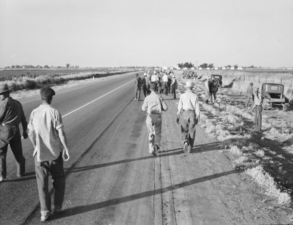 Migratory agricultural workers - cotton hoers, near Los Banos, California, 1939. Creator: Dorothea Lange.