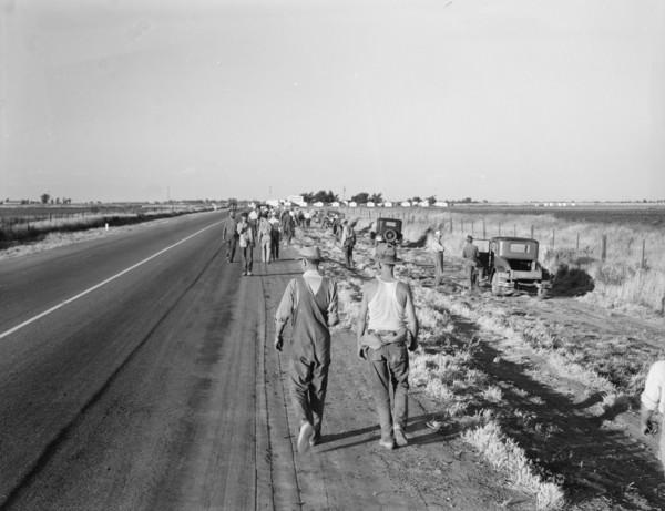 Migratory agricultural workers - cotton hoers, near Los Banos, California, 1939. Creator: Dorothea Lange.