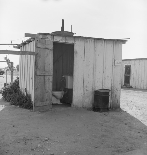 Toilet for ten cabins, men, women, and children, Arkansawyers auto camp, Greenfield, CA, 1939. Creator: Dorothea Lange.