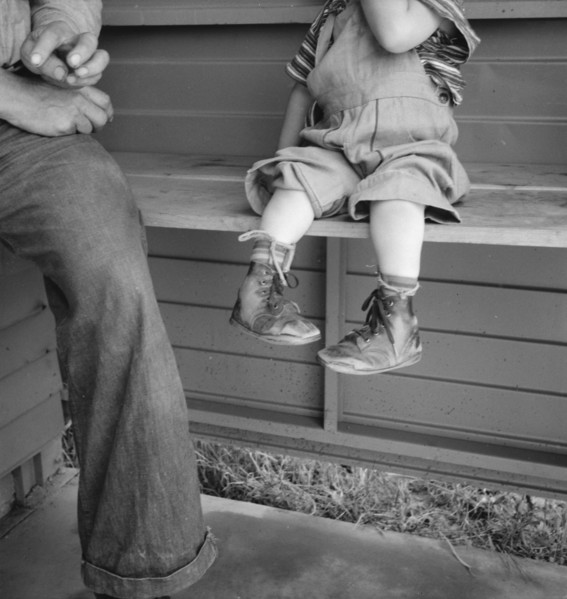 Baby with club feet wearing homemade splints, FSA camp, Tulare County, California, 1939. Creator: Dorothea Lange.