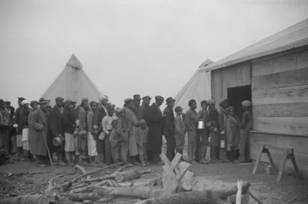 Possibly: Negroes in the lineup for food at meal time in the camp..., Forrest City, Arkansas, 1937. Creator: Walker Evans.