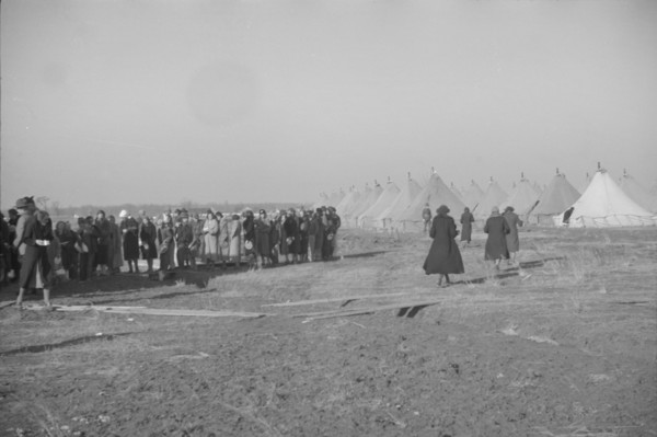 Possibly: Negroes in the lineup for food at mealtime in the camp..., Forrest City, Arkansas, 1937. Creator: Walker Evans.