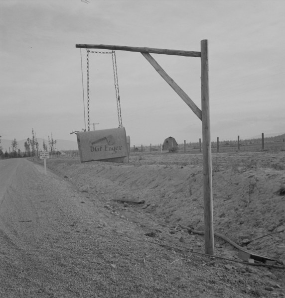 Swinging mail boxes in country where snow is deep in winter, Boundary County, Idaho, 1939. Creator: Dorothea Lange.