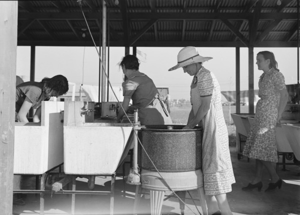 Laundry facilities in FSA migrant labor camp, Westley, California, 1939. Creator: Dorothea Lange.