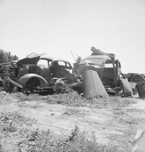 Used car lots and auto wrecking establishments, U.S. 99,  Near Tulare, California, 1939. Creator: Dorothea Lange.