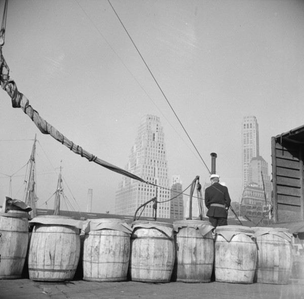 Barrels of fish on the docks at Fulton fish market ready to be shipped to..., New York, 1943. Creator: Gordon Parks.