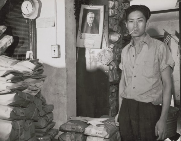 Johnnie Lew, owner of the laundry under the apartment of Mrs. Ella..., Washington, D.C., 1942. Creator: Gordon Parks.