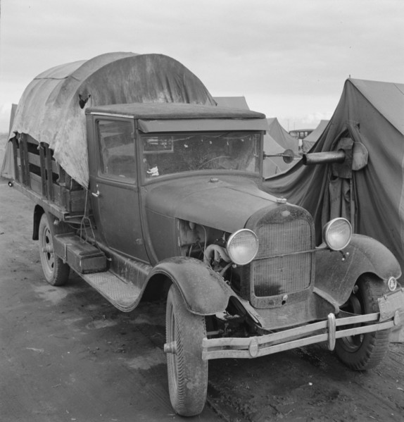Truck, baby parked on front seat, Merrill, Klamath County, Oregon, 1939. Creator: Dorothea Lange.