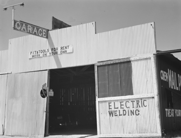 Pit and tools for rent--work on your own, U.S. 99, Fresno County, California, 1939. Creator: Dorothea Lange.