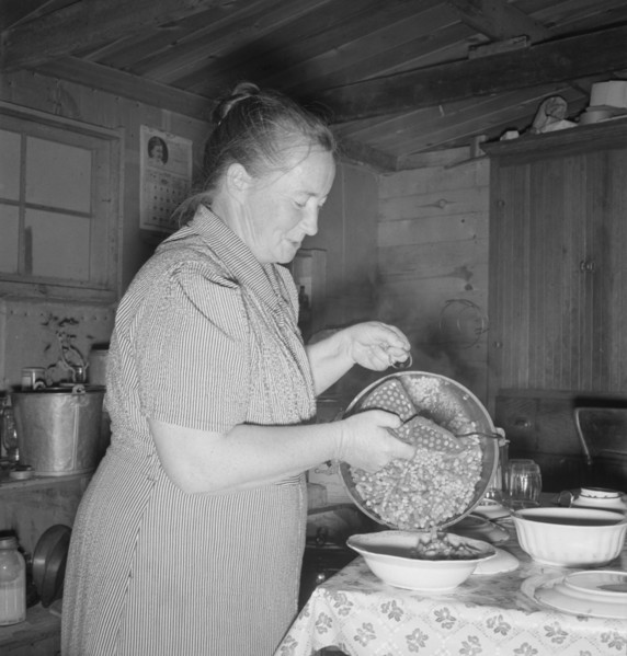Mrs. Wardlow getting dinner after church in her basement..., Dead Ox Flat, Oregon, 1939. Creator: Dorothea Lange.