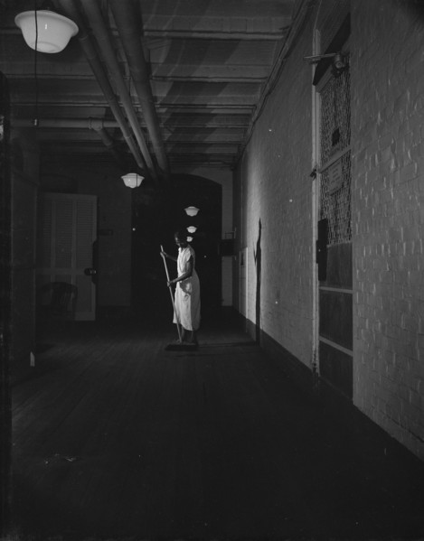 Washington, D.C. Government charwoman cleaning after regular working hours. [Mrs Ella Watson].