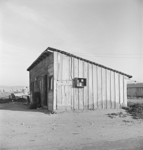 Cabin which rents for ten dollars a month in Arkansawyer's auto camp. Greenfield, California.