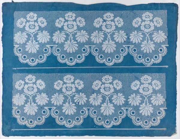 Blue sheet with two borders with a white floral and lace pattern, late 18th-mid-19th century.
