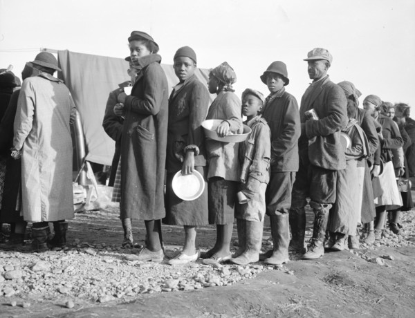 Negroes waiting for food in the Forrest City, Arkansas, concentration camp.