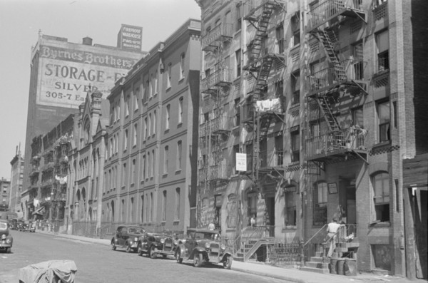 New York, New York. 61st Street between 1st and 3rd Avenues. House fronts.