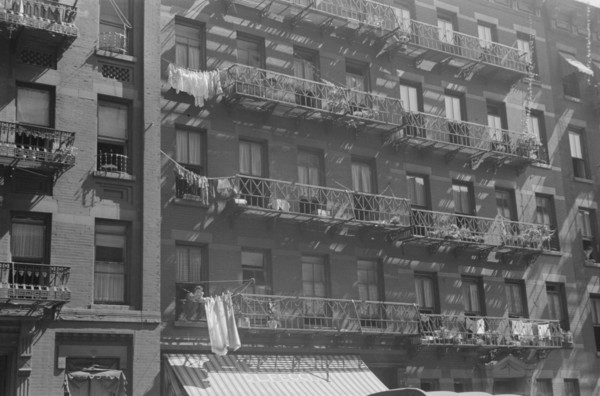 New York, New York. 61st Street between 1st and 3rd Avenues. House fronts.