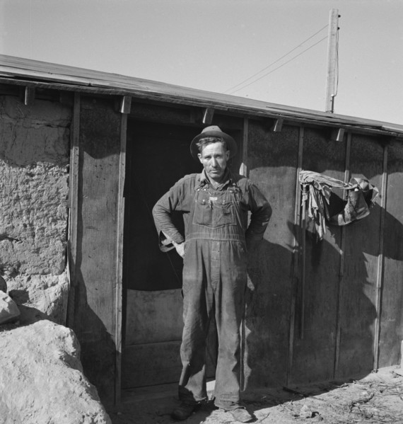 Mr. Roberts in front of his Owyhee project home. Malheur County, Oregon.