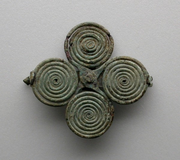 Quatrefoil spiral fibula (garment pin), 7th century BCE.