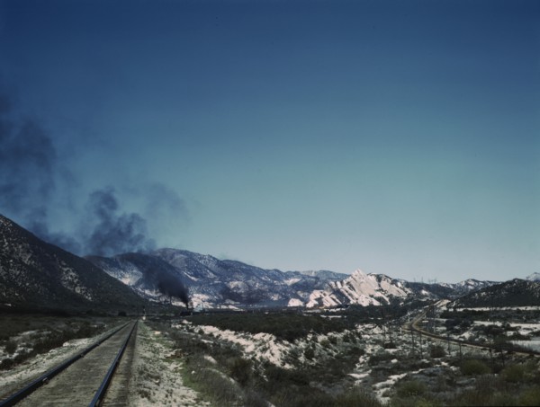 Freight train going up Cajon Pass through the San Bernardino Mountains, Cajon, Calif., 1943. Creator: Jack Delano.