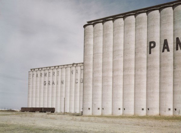 Grain elevators near Amarillo, Texas; Santa Fe trip, 1943. Creator: Jack Delano.