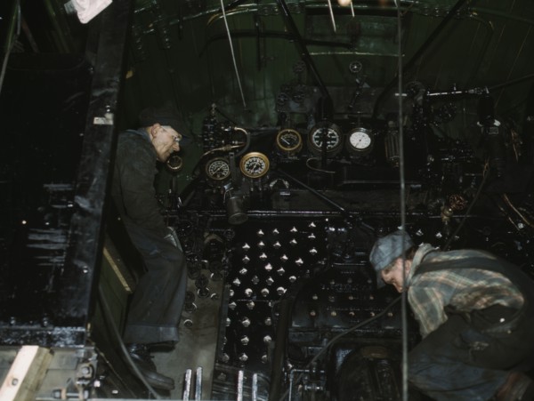 Working on the cab of a locomotive brought in for repair at the C & NW RR, Chicago, Ill., 1942. Creator: Jack Delano.
