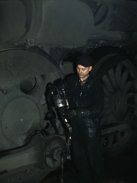 Greasing a locomotive in the roundhouse at Proviso (?) yard, C & NW RR, Chicago, Ill., 1942. Creator: Jack Delano.