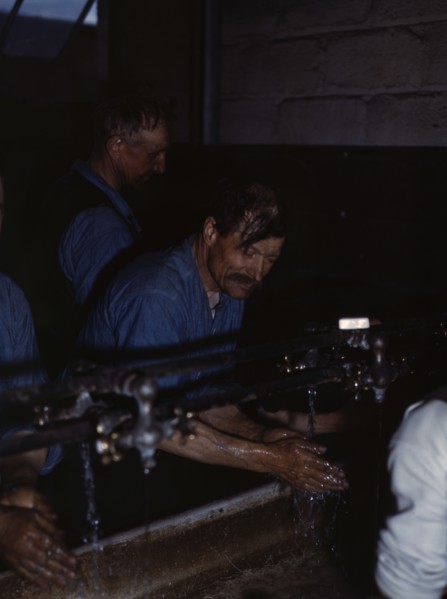 John Sabados washing up after a day's work..., Proviso yard of C & NW RR, Chicago, Ill., 1943. Creator: Jack Delano.