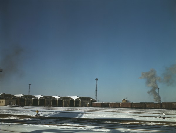 Train pulling out of the freight house at C & NW RR's Proviso Yard, Chicago, Ill., 1942. Creator: Jack Delano.