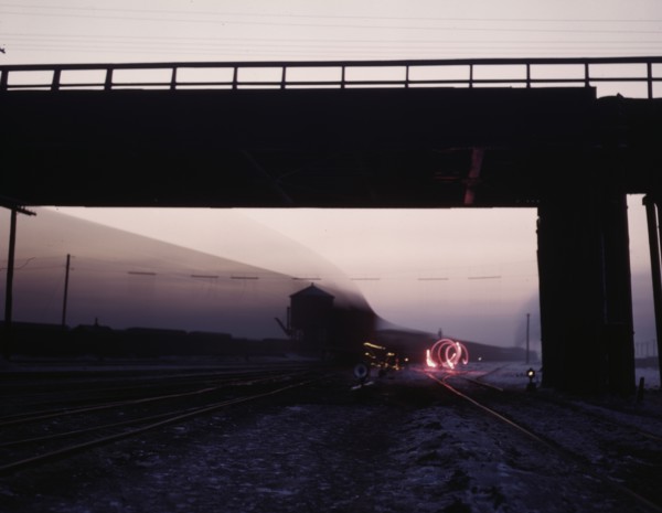 View in a departure yard at C & NW RR's Proviso (?) yard at twilight, Chicago, Ill., 1942. Creator: Jack Delano.