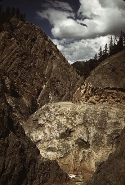 Million dollar highway [U.S. 550] is cut through massive rocks in Ouray County, Colorado, 1940. Creator: Russell Lee.