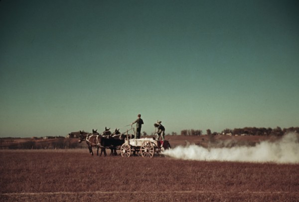 Spreading fertilizer from 4-mule team wagon, Georgia, ca. 1940. Creator: Marion Post Wolcott.