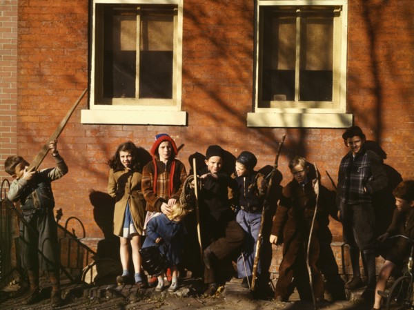 Children aiming sticks as guns, lined up against a brick building, Washington, D.C.?, 1941-1942. Creator: Unknown.