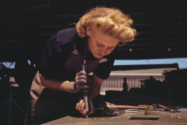 Working in the Assembly and Repair Dept. of the Naval Air Base, Corpus Christi, Texas, 1942. Creator: Howard Hollem.