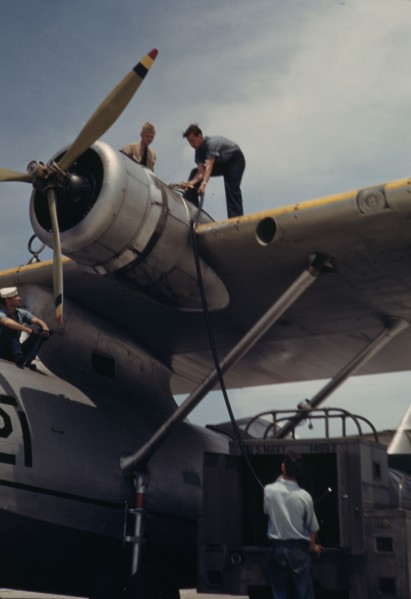 Fueling a plane at the Naval Air Base, Corpus Christi, Texas, 1942. Creator: Howard Hollem.