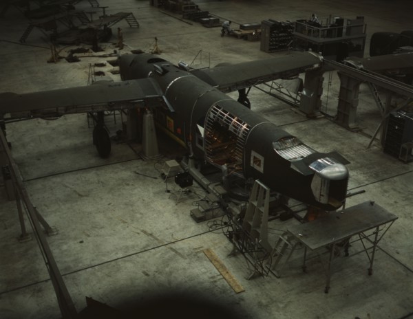 A mating operation on a transport plane...Consolidated Aircraft Corp..., Fort Worth, Texas, 1942. Creator: Howard Hollem.