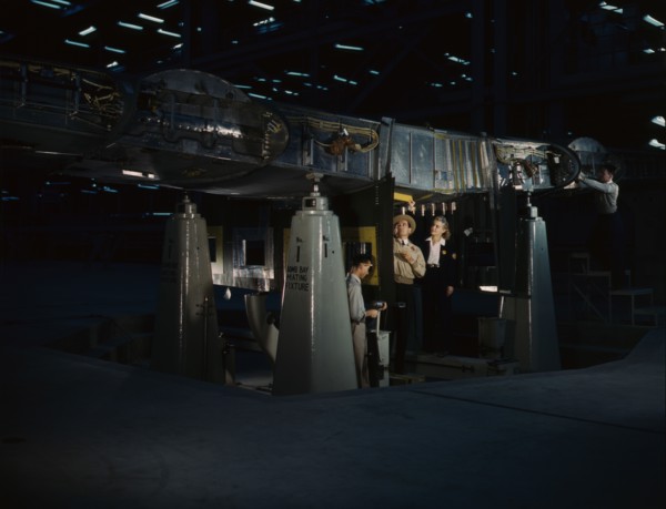 Working on the wing center section at the Consolidated Aircraft Corp..., Fort Worth, Texas, 1942. Creator: Howard Hollem.