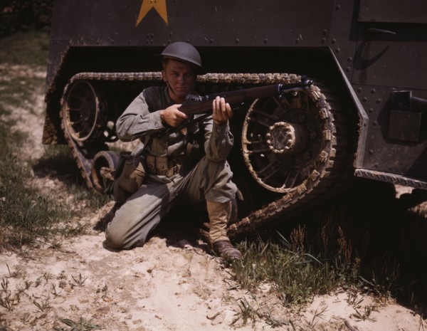 A young soldier of the armored forces holds and sights his Garand rifle like..., Fort Knox, Ky, 1942 Creator: Alfred T Palmer.