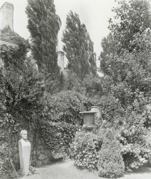 Unidentified house and garden, between 1910 and 1935.