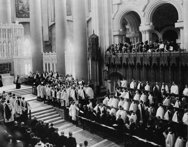 Consecration of the choir and the two chapels of the Cathedral of St. John the Divine, c1911. People standing in church.