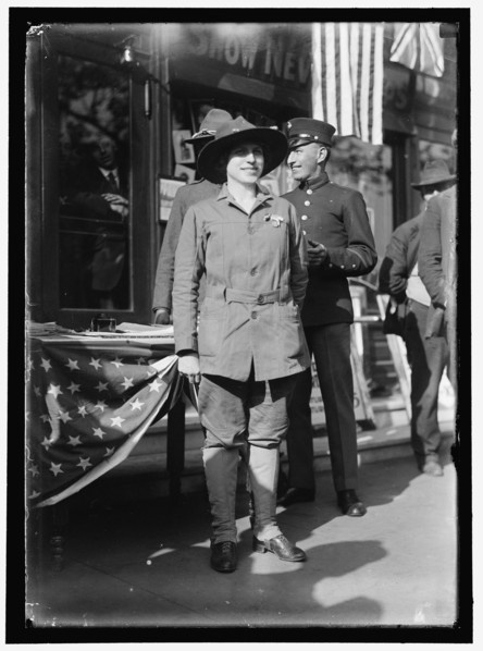Dora Rodrigues, recruiter for service branches, possibly in front of the Cosmos Theater..., May 1917 Creator: Harris & Ewing.