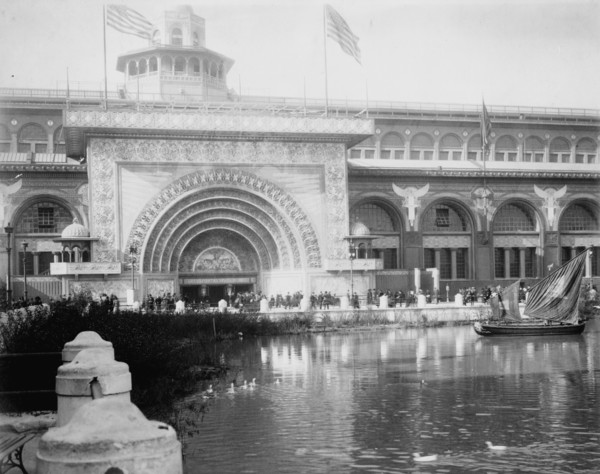 Transportation exhibit building with canal boat and ducks on canal(?) in foreground..., 1893. Creator: Frances Benjamin Johnston.