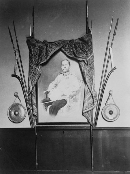 Display with portrait of a man, possibly Chulalongkorn, King of Siam, in Siam exhibit..., 1904. Creator: Frances Benjamin Johnston.